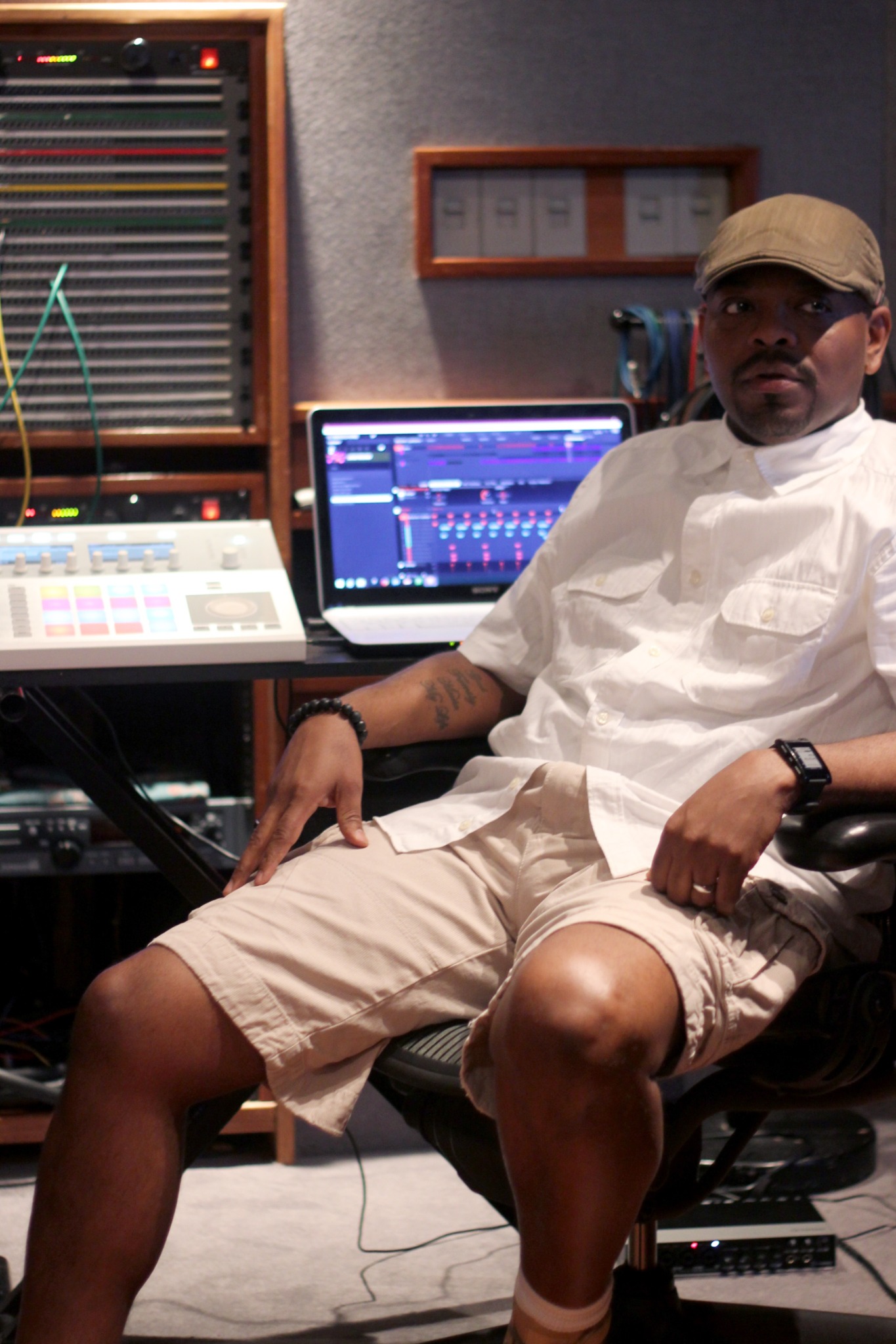 Shareef Tek Islam seated in a professional music production studio