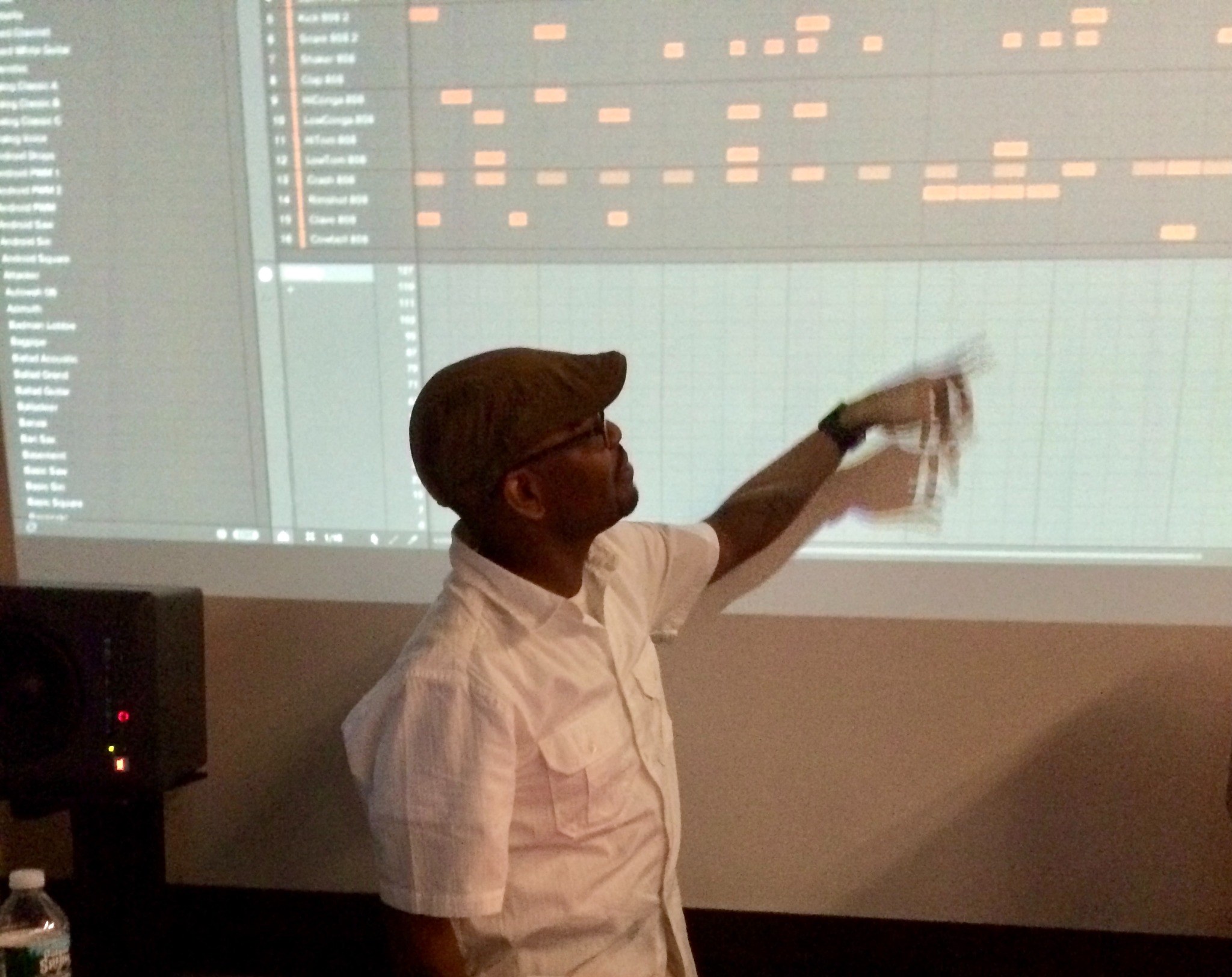 Shareef Tek Islam explaining a music production arrangement during a class